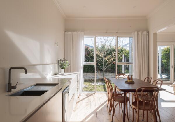 Kitchen and dining room overlooking backyard in Geelong West home.